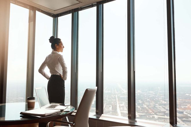Woman in high rise office building
